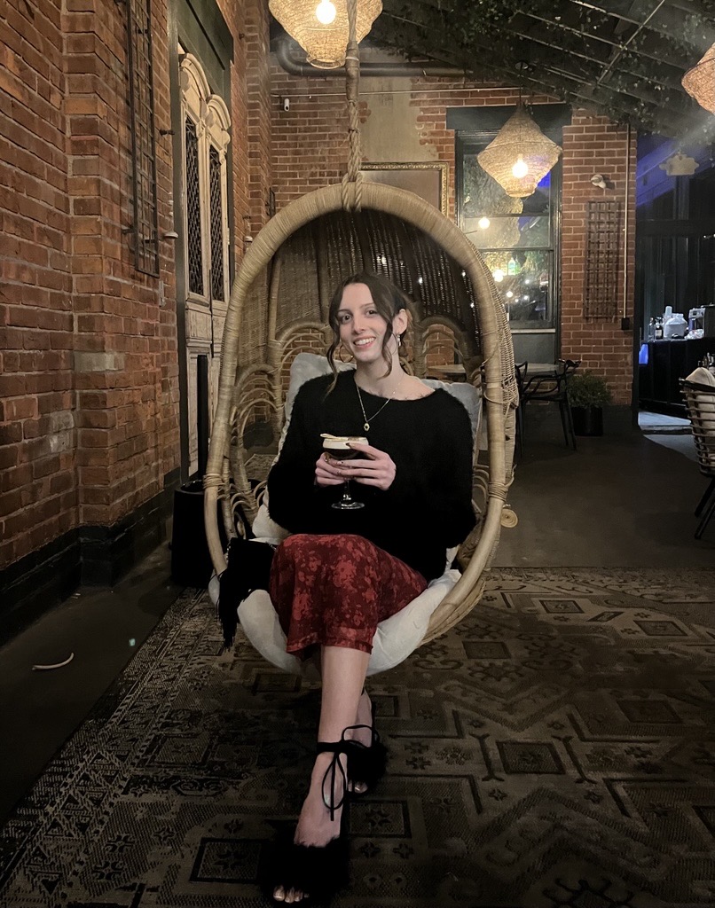 image of sophia having a drink at a local Cincinnati bar and restaurant